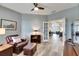 Bright living room with hardwood floors and built-in shelving at 5610 Golden Isles Dr, Apollo Beach, FL 33572