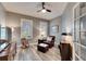 Cozy living room, complete with a ceiling fan and rocking chair at 5610 Golden Isles Dr, Apollo Beach, FL 33572