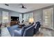 Bright living room with comfortable seating and a large TV at 5610 Golden Isles Dr, Apollo Beach, FL 33572