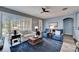 Relaxing living room with comfy seating and blue accents at 5610 Golden Isles Dr, Apollo Beach, FL 33572
