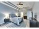 Serene main bedroom with tray ceiling and access to bathroom at 5610 Golden Isles Dr, Apollo Beach, FL 33572