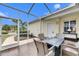 Enjoy the view from this screened porch with a fire pit at 5610 Golden Isles Dr, Apollo Beach, FL 33572