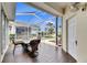 Spacious screened porch with seating and view of backyard at 5610 Golden Isles Dr, Apollo Beach, FL 33572