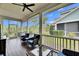 Large screened porch with scenic backyard view at 5610 Golden Isles Dr, Apollo Beach, FL 33572