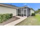 Covered patio with tiled flooring and wicker furniture at 5610 Golden Isles Dr, Apollo Beach, FL 33572