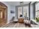 Cozy sitting area with two armchairs and a wood accent table at 5610 Golden Isles Dr, Apollo Beach, FL 33572