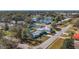 Aerial view of a house, neighborhood, and a body of water at 6008 49Th N Ave, Kenneth City, FL 33709