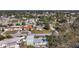 Aerial view of residential neighborhood with houses and streets at 6008 49Th N Ave, Kenneth City, FL 33709