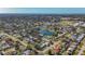 Aerial view of a residential neighborhood near a lake at 6008 49Th N Ave, Kenneth City, FL 33709