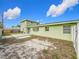 Backyard with deck and partial fence at 6008 49Th N Ave, Kenneth City, FL 33709