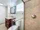 Updated bathroom with granite vanity and a spacious glass-enclosed shower at 6008 49Th N Ave, Kenneth City, FL 33709