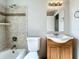 Updated bathroom with tub, shower, wood vanity, and a large mirror at 6008 49Th N Ave, Kenneth City, FL 33709