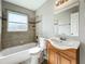 Clean bathroom, featuring a bathtub, shower, sink, and vanity at 6008 49Th N Ave, Kenneth City, FL 33709