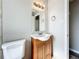 Bathroom with a vanity, toilet and mirror. Good storage at 6008 49Th N Ave, Kenneth City, FL 33709