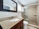 Modern bathroom, featuring granite countertop, glass shower, and updated fixtures at 6008 49Th N Ave, Kenneth City, FL 33709
