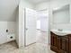 Updated bathroom with vanity and access to laundry at 6008 49Th N Ave, Kenneth City, FL 33709