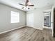 Bedroom with ceiling fan, neutral walls, and wood-look flooring at 6008 49Th N Ave, Kenneth City, FL 33709