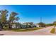 House on a corner lot with a green exterior and mature trees at 6008 49Th N Ave, Kenneth City, FL 33709