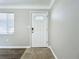 White front door with a glass window pane at 6008 49Th N Ave, Kenneth City, FL 33709