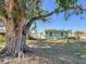 Large tree in front yard and house at 6008 49Th N Ave, Kenneth City, FL 33709
