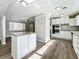 Open concept kitchen with island and stainless steel appliances at 6008 49Th N Ave, Kenneth City, FL 33709