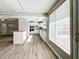 Bright kitchen features granite countertops, stainless steel appliances, and white shaker cabinets at 6008 49Th N Ave, Kenneth City, FL 33709