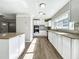 Open concept kitchen with island and stainless steel appliances at 6008 49Th N Ave, Kenneth City, FL 33709