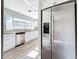 Stainless steel appliances and white kitchen cabinets at 6008 49Th N Ave, Kenneth City, FL 33709