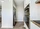 Modern kitchen featuring stainless steel refrigerator and double oven at 6008 49Th N Ave, Kenneth City, FL 33709