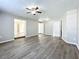 Living room featuring wood-look floors and multiple entry points at 6008 49Th N Ave, Kenneth City, FL 33709