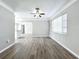Bright living room with wood-look floors and ceiling fan at 6008 49Th N Ave, Kenneth City, FL 33709