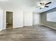 Living area with wood-look floors, updated doors, and a window at 6008 49Th N Ave, Kenneth City, FL 33709