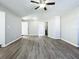 Spacious living room with wood-look floors and ceiling fan at 6008 49Th N Ave, Kenneth City, FL 33709