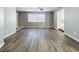 Living area with wood-look floors and ceiling fan at 6008 49Th N Ave, Kenneth City, FL 33709