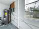 Unfinished mechanical room with water heater and exterior view at 6008 49Th N Ave, Kenneth City, FL 33709