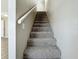 Gray carpeted staircase with simple white railing at 6008 49Th N Ave, Kenneth City, FL 33709
