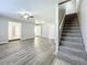 Gray carpeted staircase leading to the second floor at 6008 49Th N Ave, Kenneth City, FL 33709