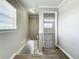 Upstairs hallway with wood-look floors and access to bedrooms at 6008 49Th N Ave, Kenneth City, FL 33709