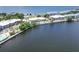 Aerial view showcasing waterfront property, pool, and nearby park at 611 Destiny Dr # 216, Ruskin, FL 33570