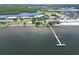 Aerial perspective of waterfront property with private dock and beach access at 611 Destiny Dr # 216, Ruskin, FL 33570
