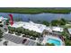 Aerial view of building, parking, and waterfront pool at 611 Destiny Dr # 216, Ruskin, FL 33570