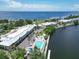 Aerial view of waterfront community with pool and lush landscaping at 611 Destiny Dr # 216, Ruskin, FL 33570