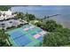 Aerial view of tennis and pickleball courts with waterfront access at 611 Destiny Dr # 216, Ruskin, FL 33570