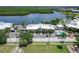 Aerial view of waterfront community with pool, parking, and lush landscaping at 611 Destiny Dr # 216, Ruskin, FL 33570