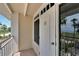 White door and balcony with partial water view at 611 Destiny Dr # 216, Ruskin, FL 33570