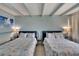 Bedroom with two double beds and beach-themed bedding at 611 Destiny Dr # 216, Ruskin, FL 33570