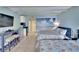 Bedroom with two double beds, kitchenette, and TV at 611 Destiny Dr # 216, Ruskin, FL 33570