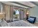 Bedroom with ocean view and comfy seating at 611 Destiny Dr # 216, Ruskin, FL 33570