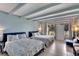 Bedroom with two double beds, ocean decor, and balcony access at 611 Destiny Dr # 216, Ruskin, FL 33570
