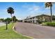 Two-story building exterior with parking area and landscaping at 611 Destiny Dr # 216, Ruskin, FL 33570